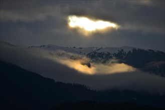 Sunlight breaking through an overcast sky