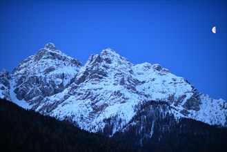 Moon over Serles mountain or Waldrastspitze mountain