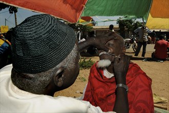 Barber at the market of Ngaoundere