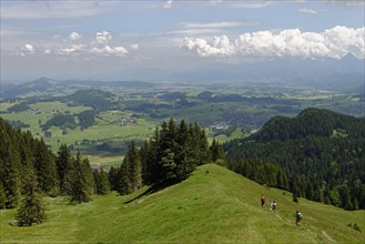Climbers and views from Kappeler Alp below Mt Edelsberg and Mt Alpspitze