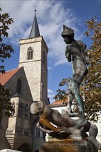 Fountain sculpture 'Raufende Knaben' and Aegidienkirche church on Wenigemarkt square