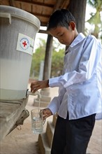 Boy drinking filtered water