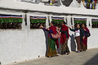 Pilgrims walking around Boudnath Stupa