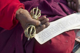 Tibetean monk reading the holy scriptures in Tibetan language