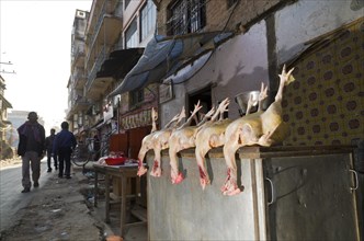 Chicken bodies displayed for sale on the street