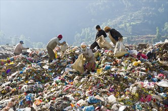 Workers sorting out garbage at Aletar garbage dump