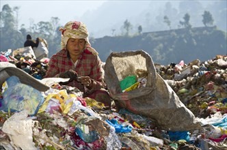 Woman sorting out garbage at Aletar garbage dump
