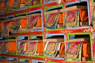 Colorful shelf with tibetean prayerbooks