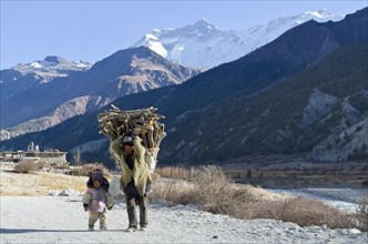 Woman walking with a small child