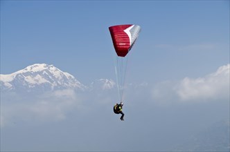 Paraglider sailing through the air