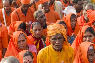 Procession of devotees dressed in orange