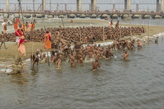Taking a purifying bath as part of the initiation of new sadhus at the Sangam