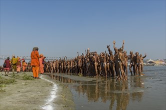 Group of new sadhus standing in the river Ganges