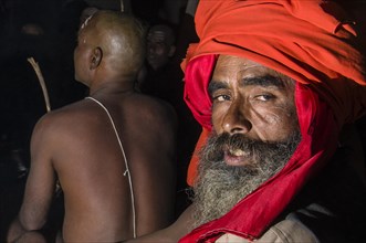 Portrait of a guru guiding the initiation of new sadhus