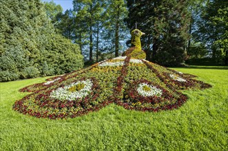 Sculpture of a peacock made of blooming flowers