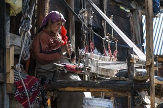 Local woman weaving with a handloom