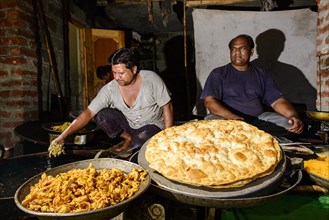 Two men with kashmiri bread and namkin