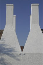 Four chimneys of a Bornholm herring smokehouse