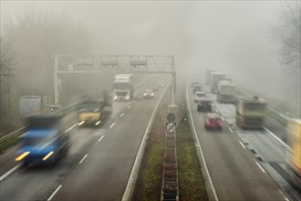 Traffic flow on a highway in the fog