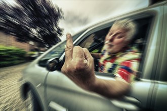 Car driver giving the finger