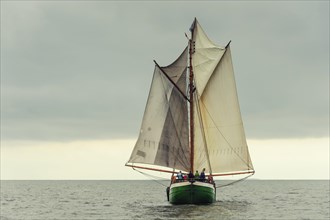Gaff-rigged schooner with the sails in the butterfly position
