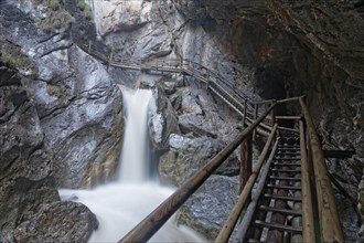 Wooden bridge and a waterfall in Baerenschuetzklamm gorge