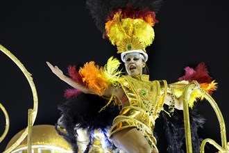 Dancer on a float in a colourful costume