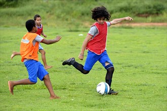 Young people playing football