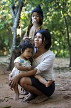 Young mother with two girls in the community of Mbya-Guarani Indians