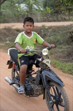 Boy on a motor bike