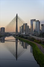 Modern skyscrapers and the Octavio Frias de Oliveira bridge over the Rio Pinheiros River