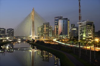 Modern skyscrapers and the Octavio Frias de Oliveira bridge over the Rio Pinheiros River at night
