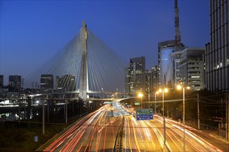 Modern skyscrapers and the Octavio Frias de Oliveira bridge over the Rio Pinheiros River at night