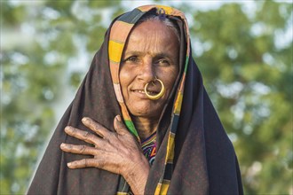 Elderly Ahir woman in traditional clothes with a nose ring