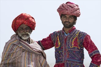 Two Rabari Men in traditional colorful clothes