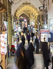 People and shops in the old Kashan bazaar