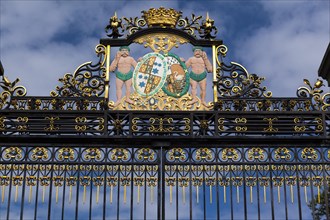 Entrance gate with a coat of arms