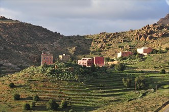 Farmhouses in a barren mountain landscape