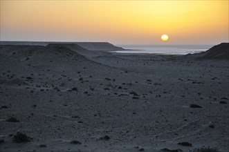 Sunset over the stone desert at the Rio de Oro Bay