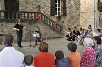 Classical concert taking place in the town hall square of Cordes-sur-Ciel