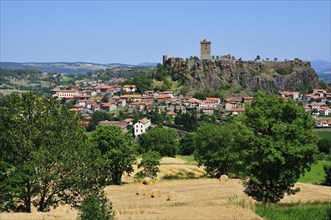 Castle of Polignac on a basalt rock above the village