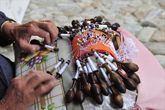 Old woman making lace