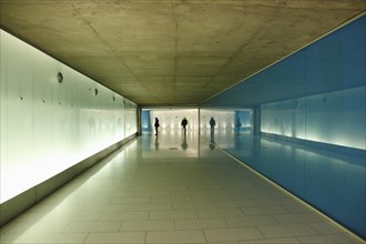People walking in a pedestrian tunnel