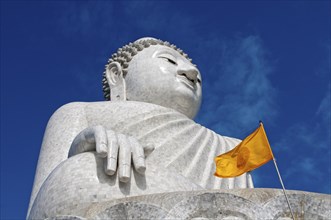 Great Buddha with a yellow Dharmacakra flag