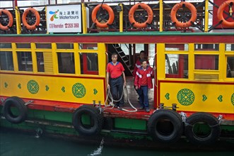 Crew of the excursion ship 'Noble House' standing ready with ropes to dock