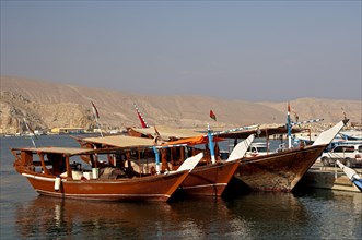 Three dhows are ready for excursions in the port of al-Khasab or al-Chasab