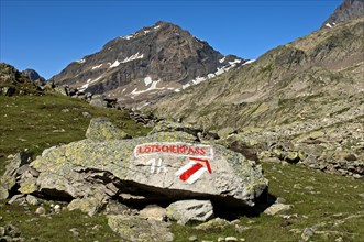 White-red-white markings of hiking trail and a signpost to Loetschen Pass