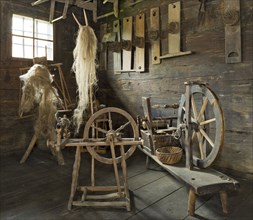 Spinning wheels in a farmhouse room