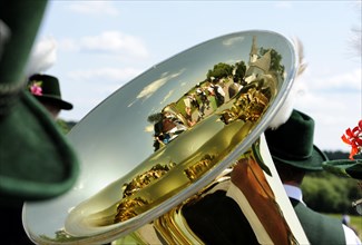 Marching band reflected in a tuba