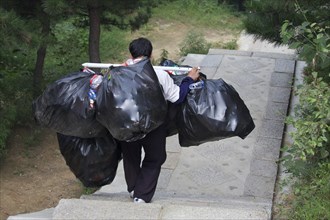 Garbage collector at the Great Wall of China